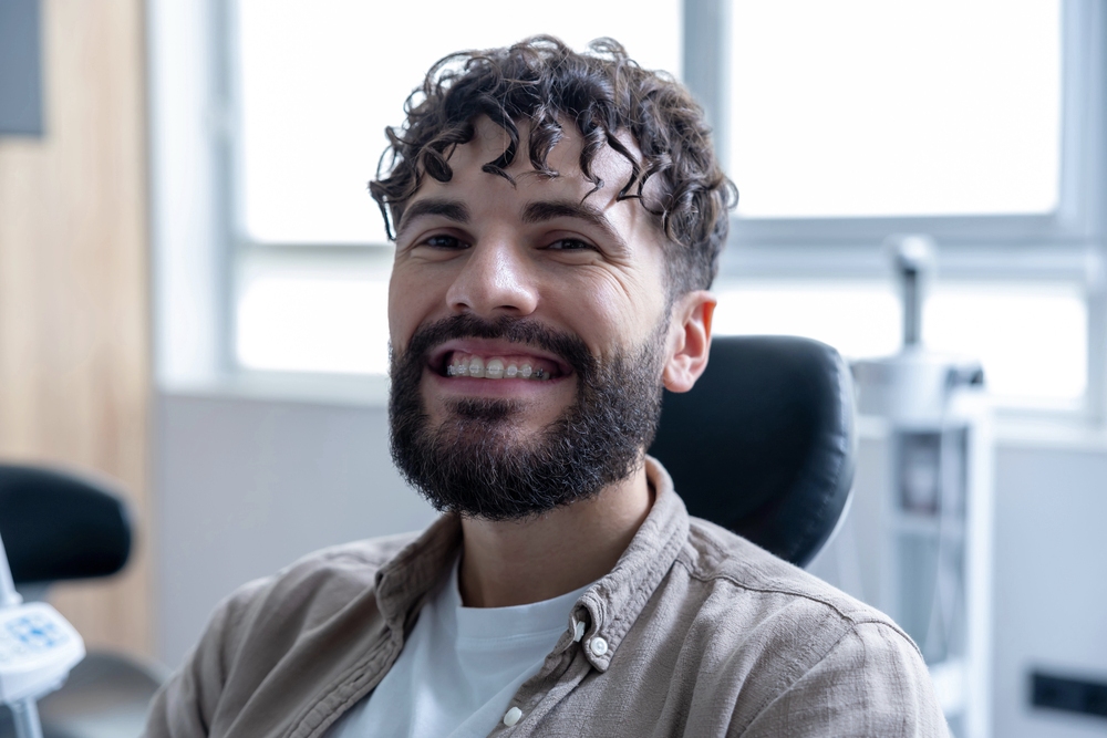 attractive smiling bearded man with clear braces - How to Clean Braces: The Routine That Actually Protects Your Teeth in Sunnyvale TX