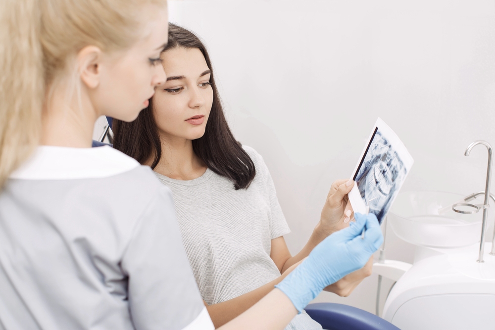 orthodontist showing x ray image to patient - Mouth Breather Face: What It Is, What Causes It, and Whether It Can Be Corrected in Sunnyvale TX